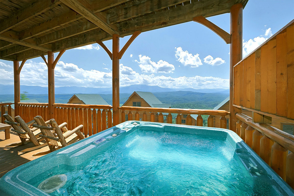 From this hot tub—located on a spacious, rustic balcony—you'll see the dramatic Smoky Mountains stretching for miles in the distance.